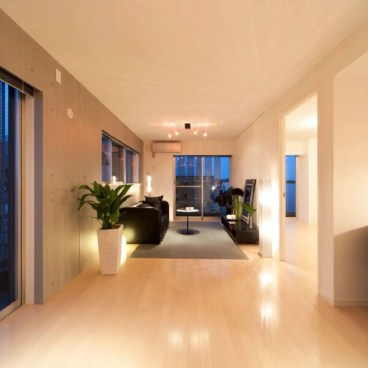 A hallway with white floors and walls.